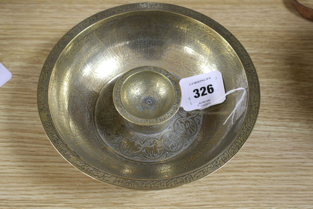 A large brass Persian magic bowl, Qajar dynasty, with inscribed decoration, diameter 21cm